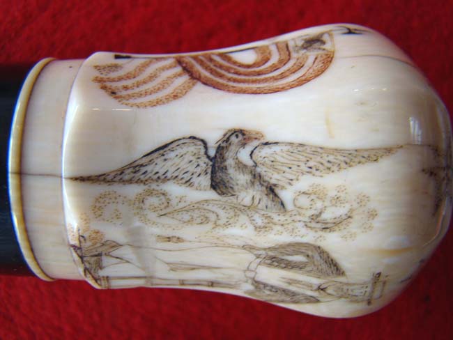 A RARE and beautiful 19th century American presentation walking stick with an eight sided scrimshawed ivory knob and a spiral twist entwined rope pattern dark rosewood shaft. — image 4